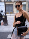 Model wearing handcrafted BLACKWOOD Gloria Black Croco leather handbag, front view