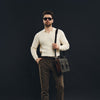 Model carrying BLACKWOOD Thunder Brown Epsom leather shoulder bag in a refined everyday outfit