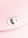 Close-up of shiny rose leather texture and metal clasp on BLACKWOOD Aurora handbag