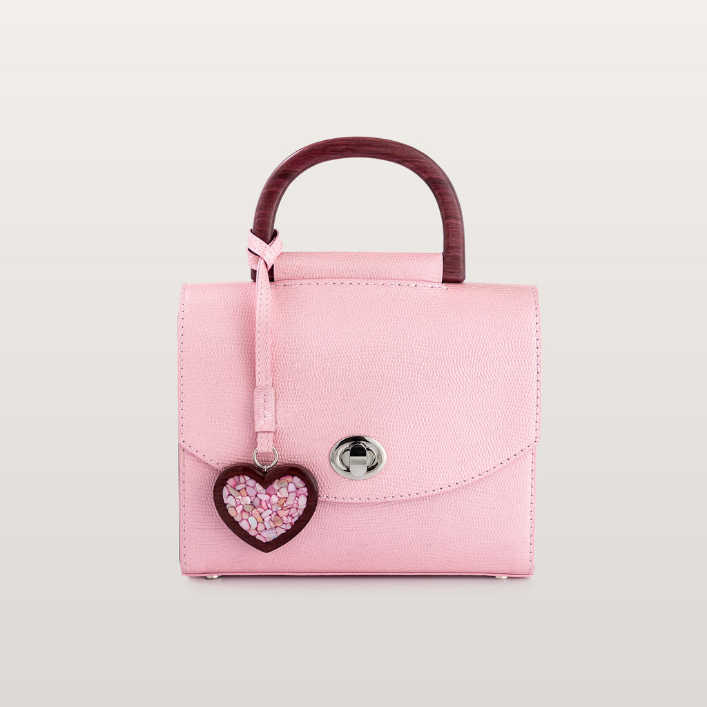 Front view of BLACKWOOD Aurora Purple Heart Shiny Rose pink leather handbag with heart charm