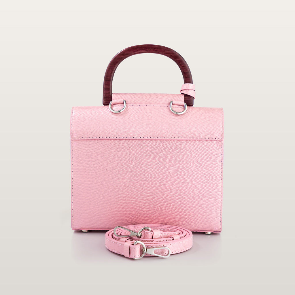 Back view of BLACKWOOD Aurora Purple Heart Shiny Rose handbag with structured pink leather design