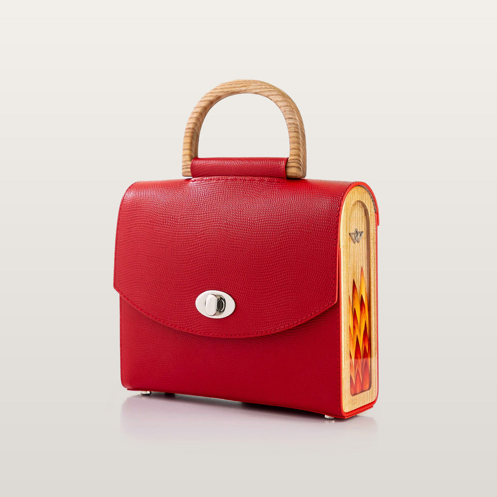 Red handbag with wooden handle and side panel 
