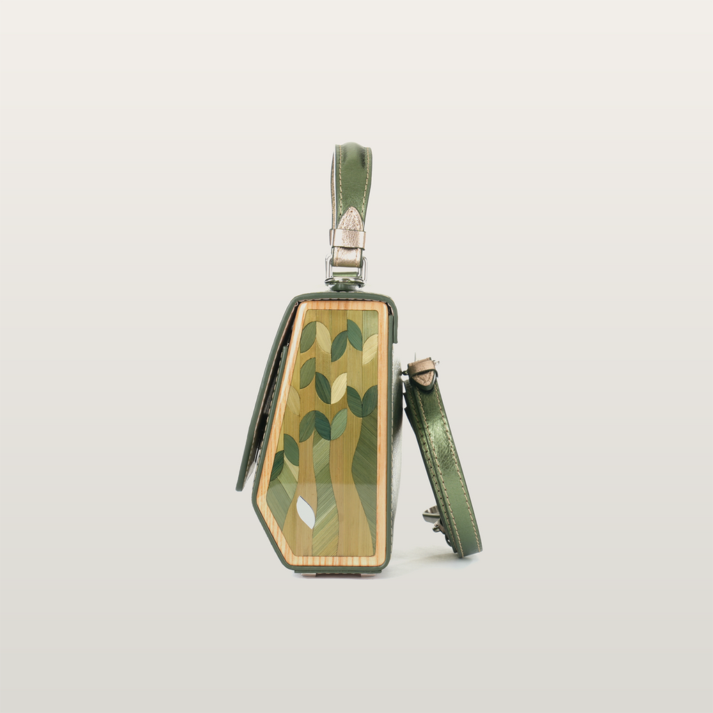 Side silhouette of handcrafted Fjord Mavka bag featuring geometric straw art by RUDA Studio