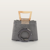 Back view of Sandy Povitrulia bag with coiled matching leather crossbody strap