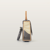 Side view of Sandy Povitrulia bag featuring geometric straw marquetry sealed under jewelry resin by RUDA Studio
