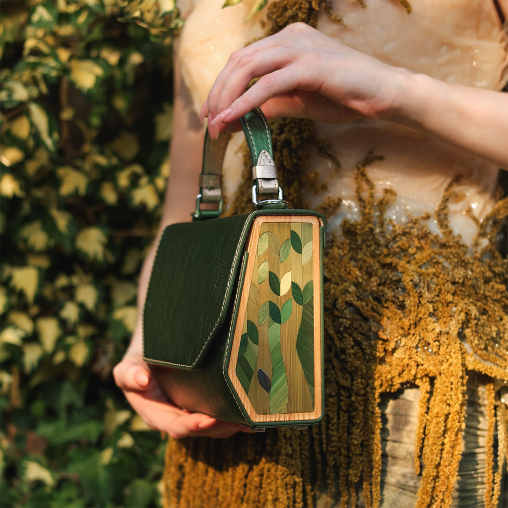 Rye straw marquetry inlay sealed in clear jewelry resin on the wooden side of Fjord Mavka bag