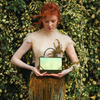 Model holding the limited edition ANIMA Fjord Mavka handbag handcrafted by BLACKWOOD