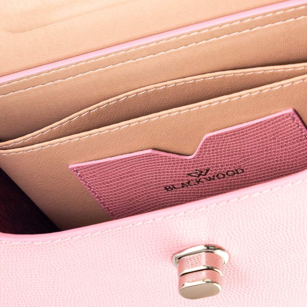Interior view of BLACKWOOD Aurora Purple Heart Shiny Rose handbag with leather lining and pocket