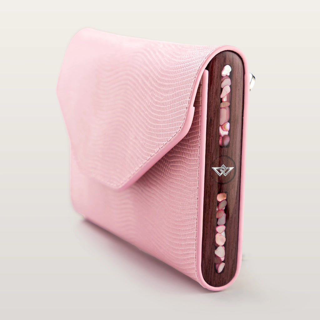 Side view of BLACKWOOD Essence Shiny Rose phone bag with pink leather strap detail