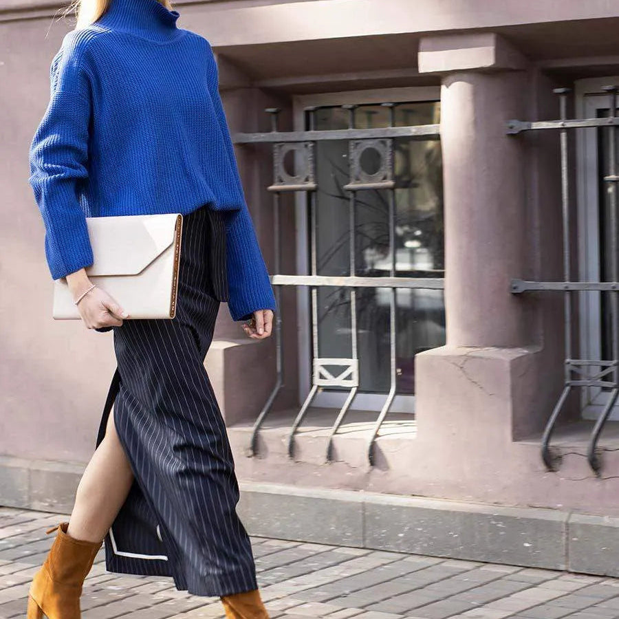 Beige Saffiano MacBook case worn as a refined accessory by BLACKWOOD Atelier